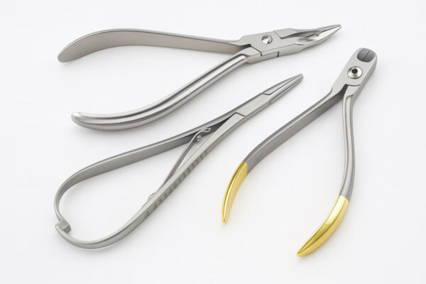 Three orthodontic pliers—Mathieu ligature plier, slim Weingart utility plier, and hard-wire cutter with gold-tipped handles—arranged diagonally on a white background.